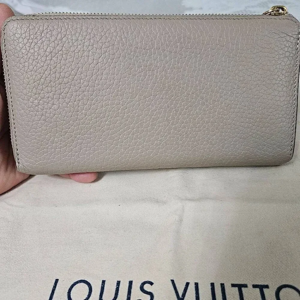 Louis Vuitton Taurillon portefeuille Comete long zip wallet